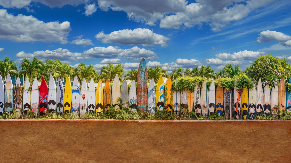 Old surfboards lined up as a fence near Paia, Maui, Hawaii
